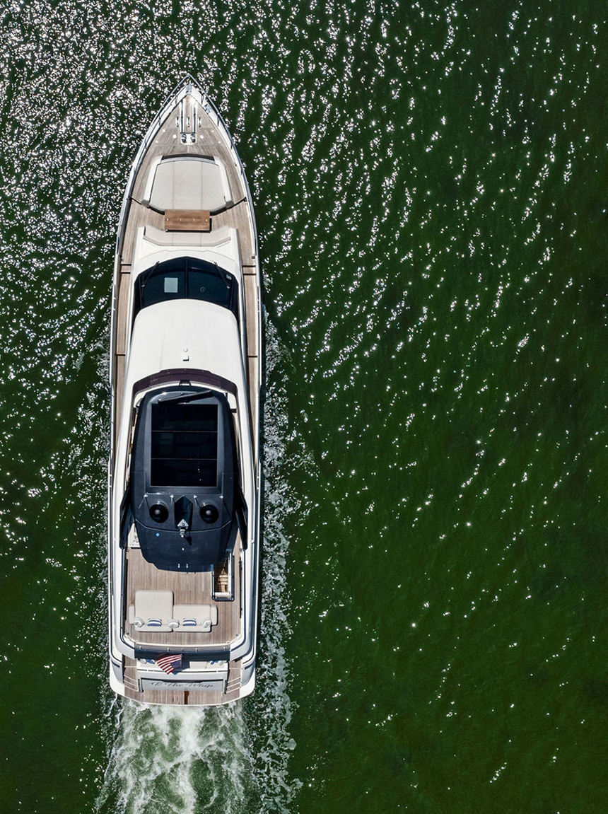 Top-down drone view of the Brass Ring luxury yacht on calm water